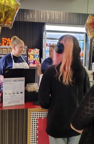 Sada Clemens places an order at Claws Cafe