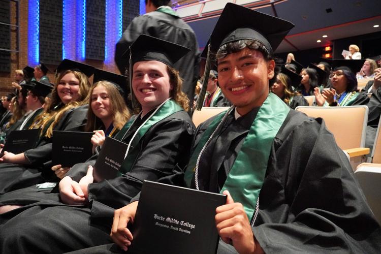 students holding diploma.jpg