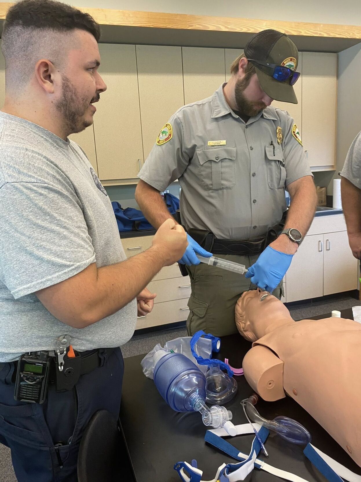 Burke EMS instructor Josh Harris, left, teaches cardiac arrest management to N.C. State Parks personnell during a recent training session.