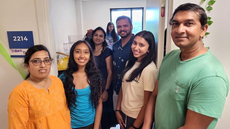 Two families help new students move in