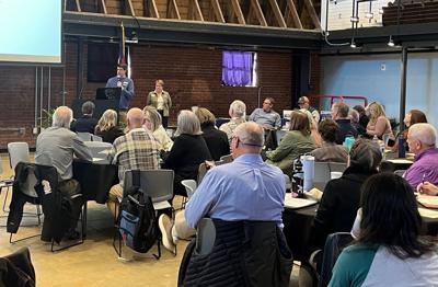 Ryan Carter, Catawba Riverkeeper policy manager, outlines the group's 2025-26 legislative goals for the crowd at last week's James James Watershed Symposium on the campus of the N.C. School of Science and Mathematics-Morganton.