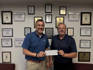 The Paris News donates $10K to Children’s Advocacy Center of Paris via Walls Foundation