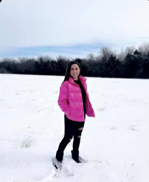 Chloe Emeyabbi strikes a pose in the snow.jpg