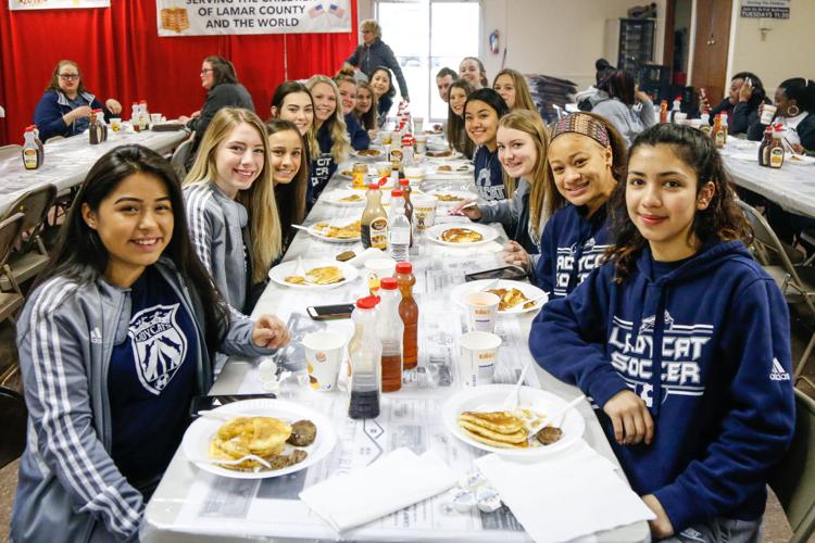 Making Pancakes Kiwanis members begin serving first of thousands