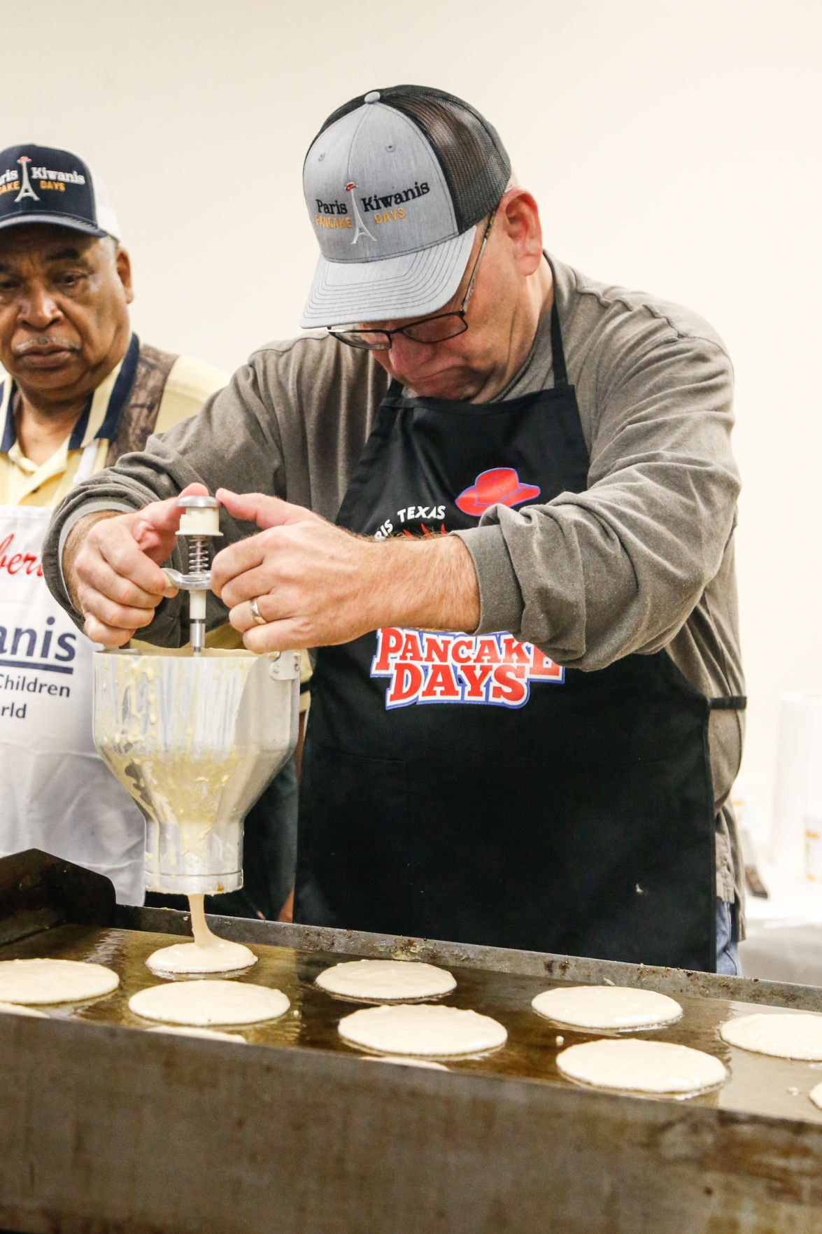 Making Pancakes Kiwanis members begin serving first of thousands