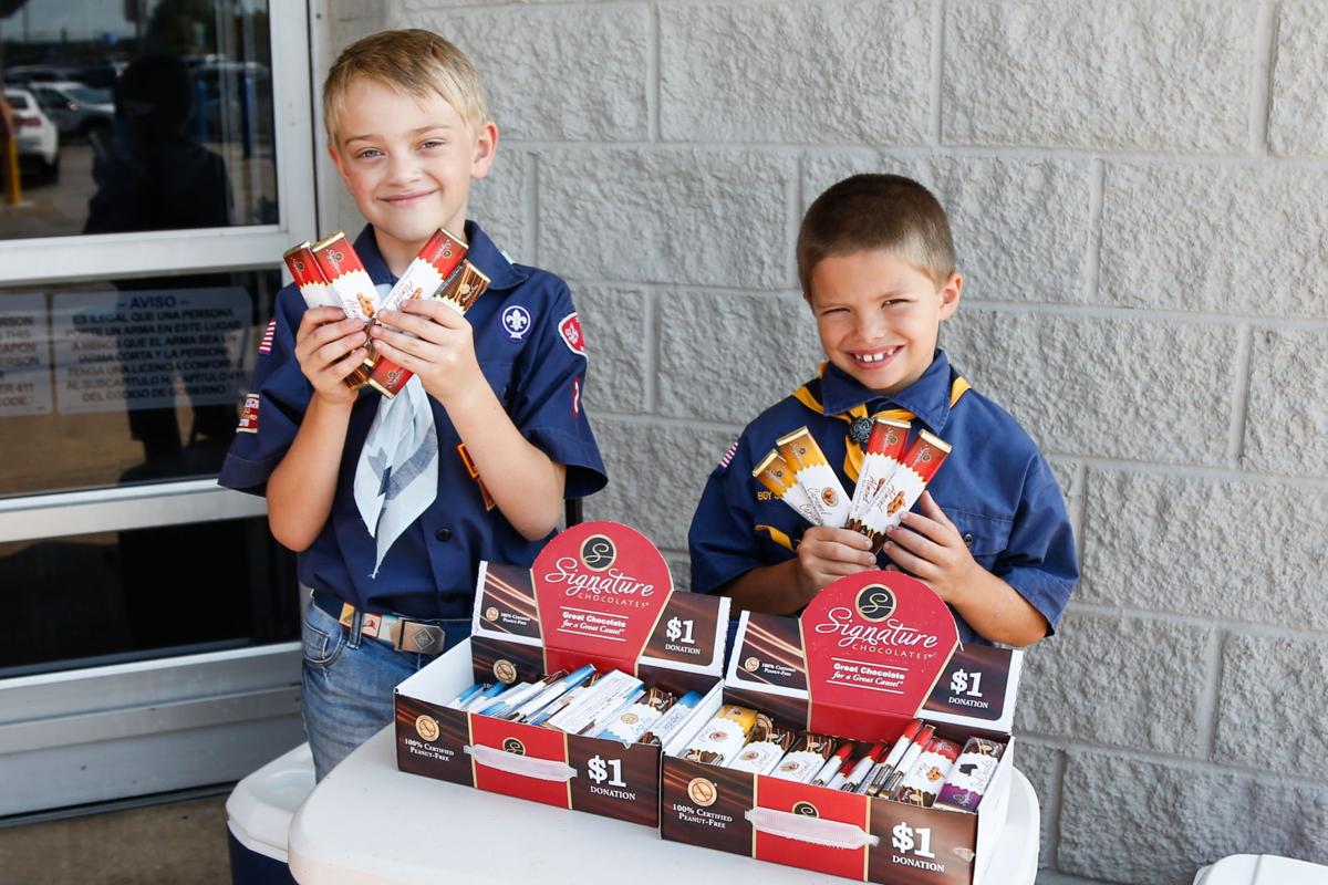 Community Faces Boy Scouts sell chocolate