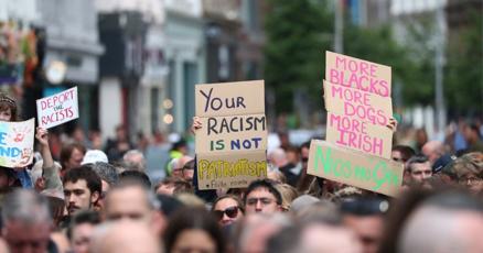 Thousands rally in Belfast to condemn anti-immigrant rioting that followed stabbing