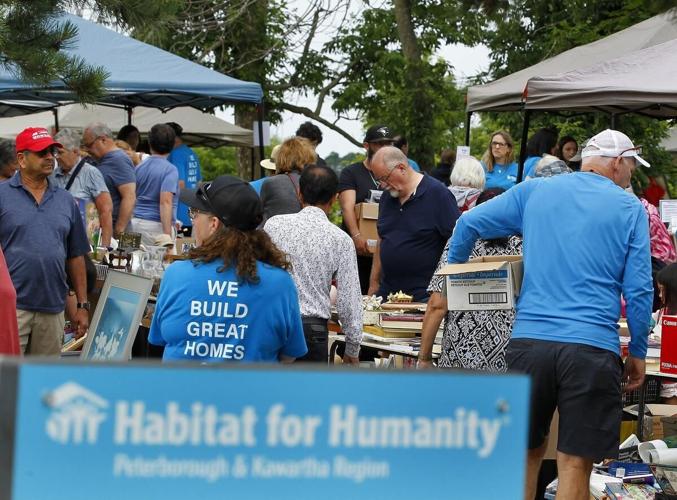 Photos Hundreds flock to yard sale at Habitat for Humanity ReStore in