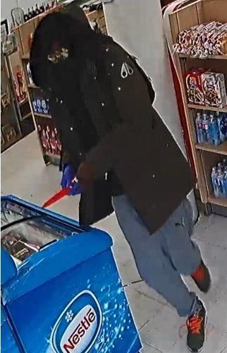 Police release photos after armed robbery at Cambridge convenience store