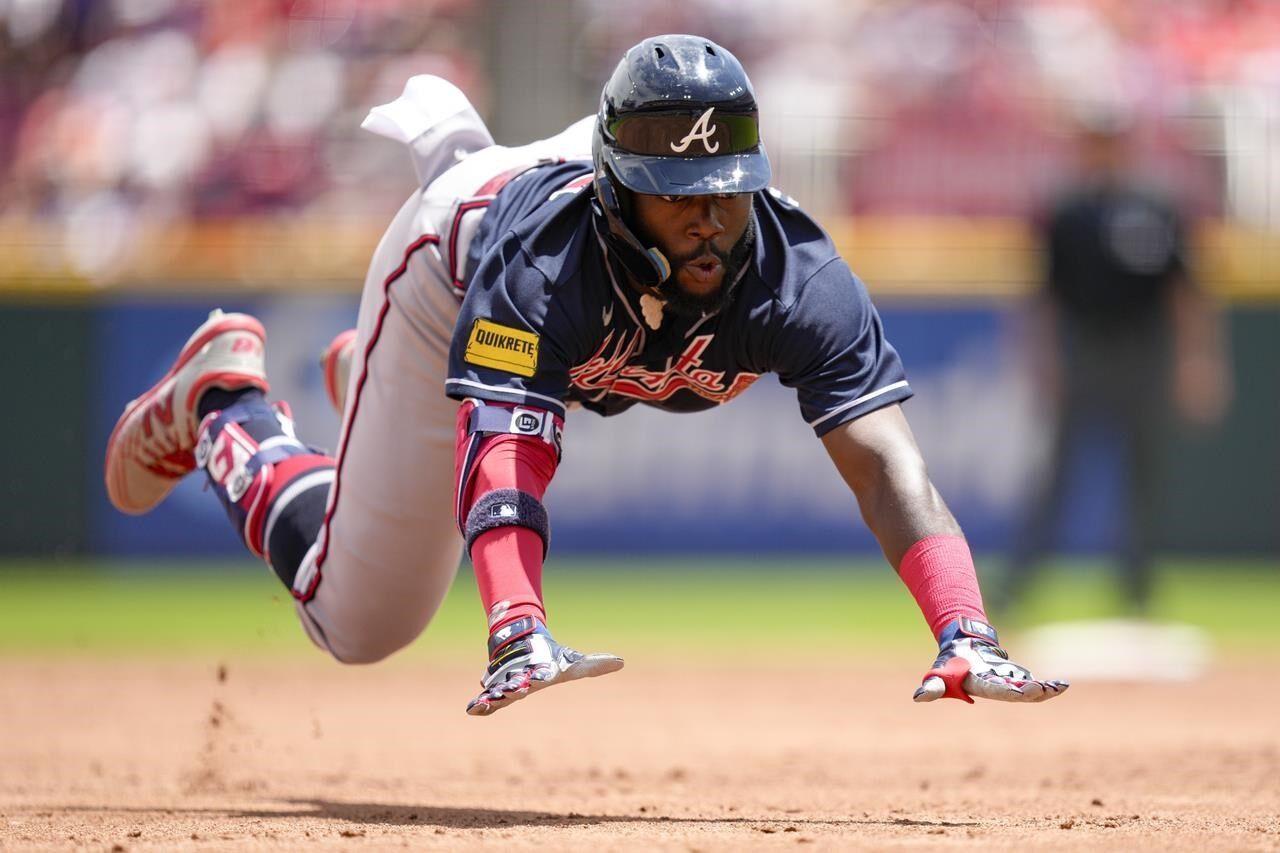 Murphy's 2-run homer in 10th powers Braves past Reds, 5-4 - The