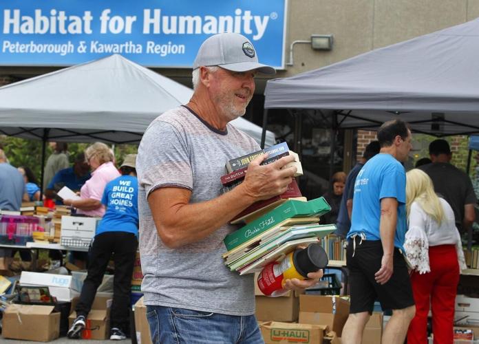Photos Hundreds flock to yard sale at Habitat for Humanity ReStore in