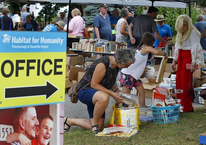 Photos Hundreds flock to yard sale at Habitat for Humanity ReStore in