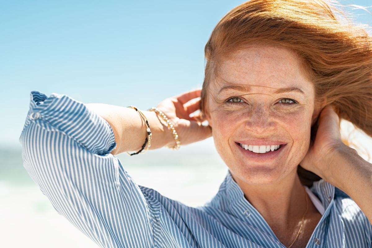 Smiling mature woman at beach
