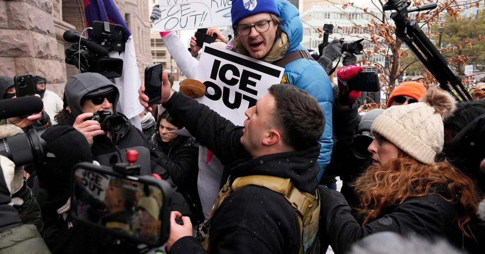 Photos show anti - ICE crowd chase off pro - ICE demonstrators from Minneapolis streets