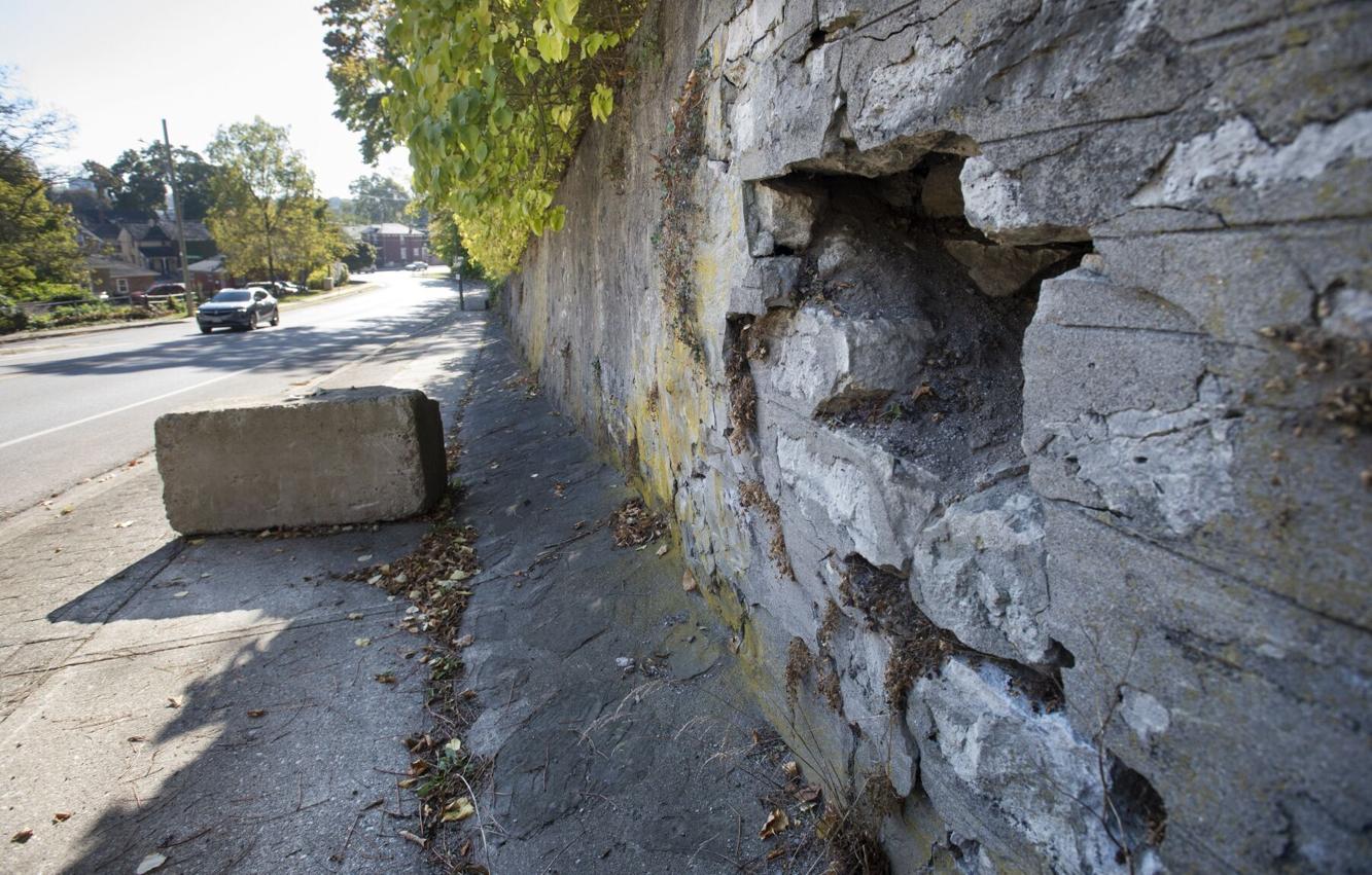 Cambridge heritage on fence about retaining wall options