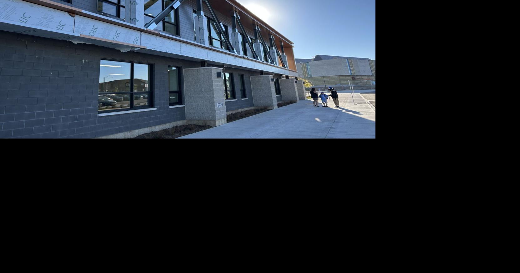 Tensions over custodial services mark the opening of two elementary schools that will eventually support almost 900 students.   