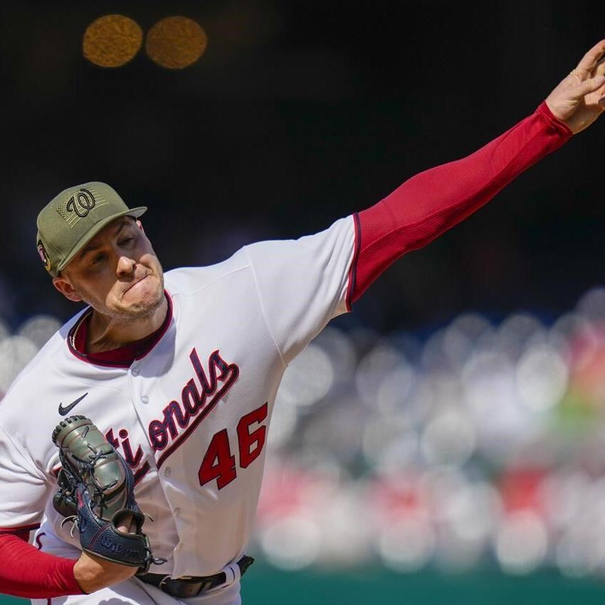 Washington Nationals shortstop CJ Abrams (5) looks to throw to first base  during a baseball game against the Detroit Tigers at Nationals Park,  Friday, May 19, 2023, in Washington. (AP Photo/Alex Brandon