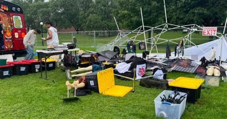 Festival-goers were told to take shelter in Kitchener City Hall Saturday as strong winds and rain blew some tents over and flooded the area