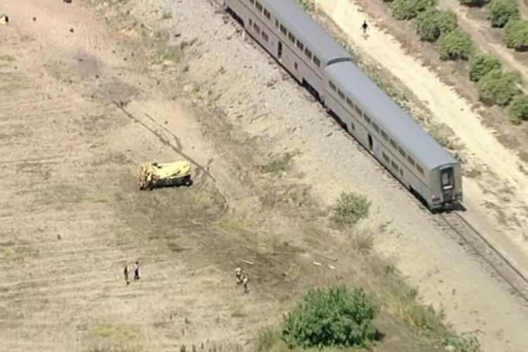 Amtrak train with 198 passengers derails after hitting truck on tracks ...