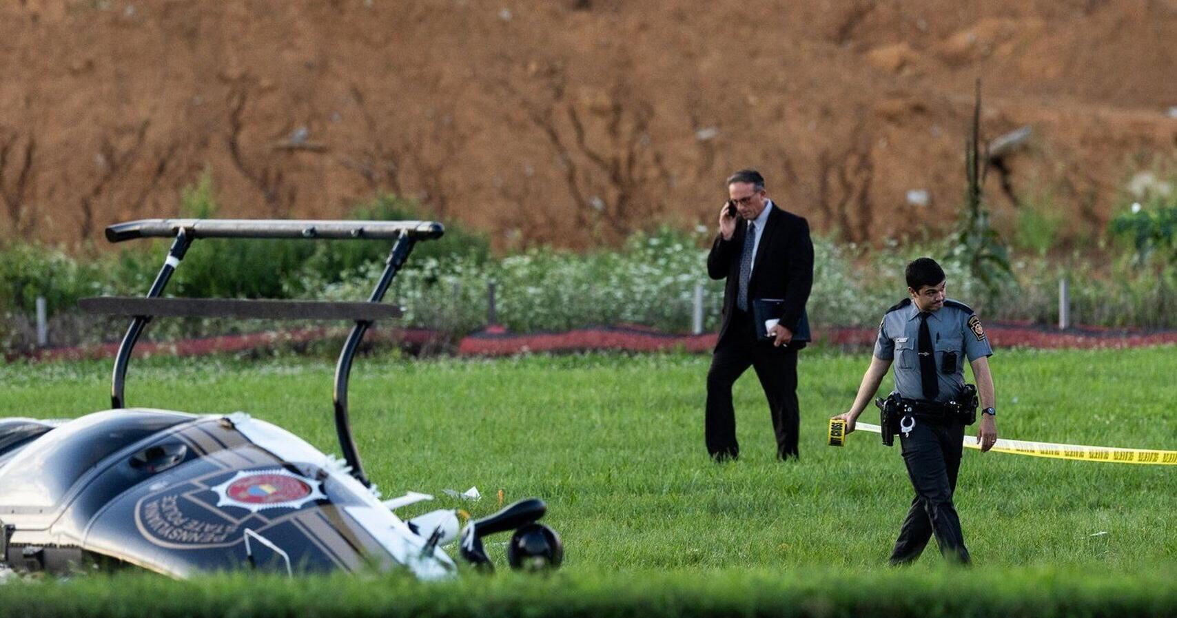 Investigators probe a dramatic midair crash as a landing plane hits hovering police helicopter