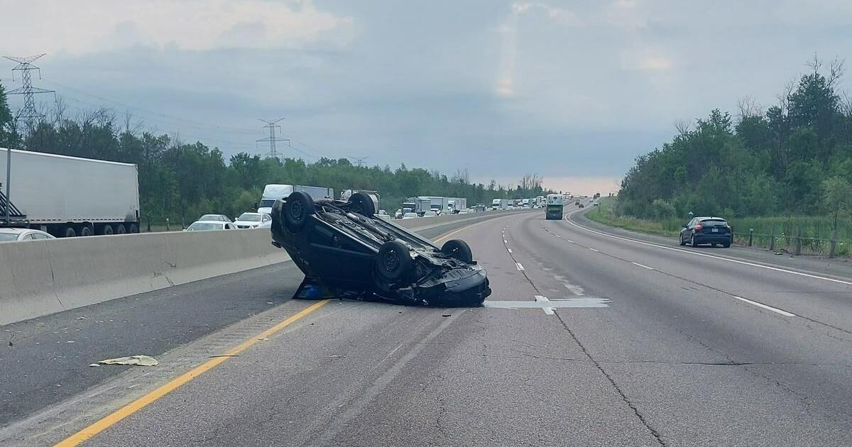 Driver clips vehicle, rolls over on highway during rush hour