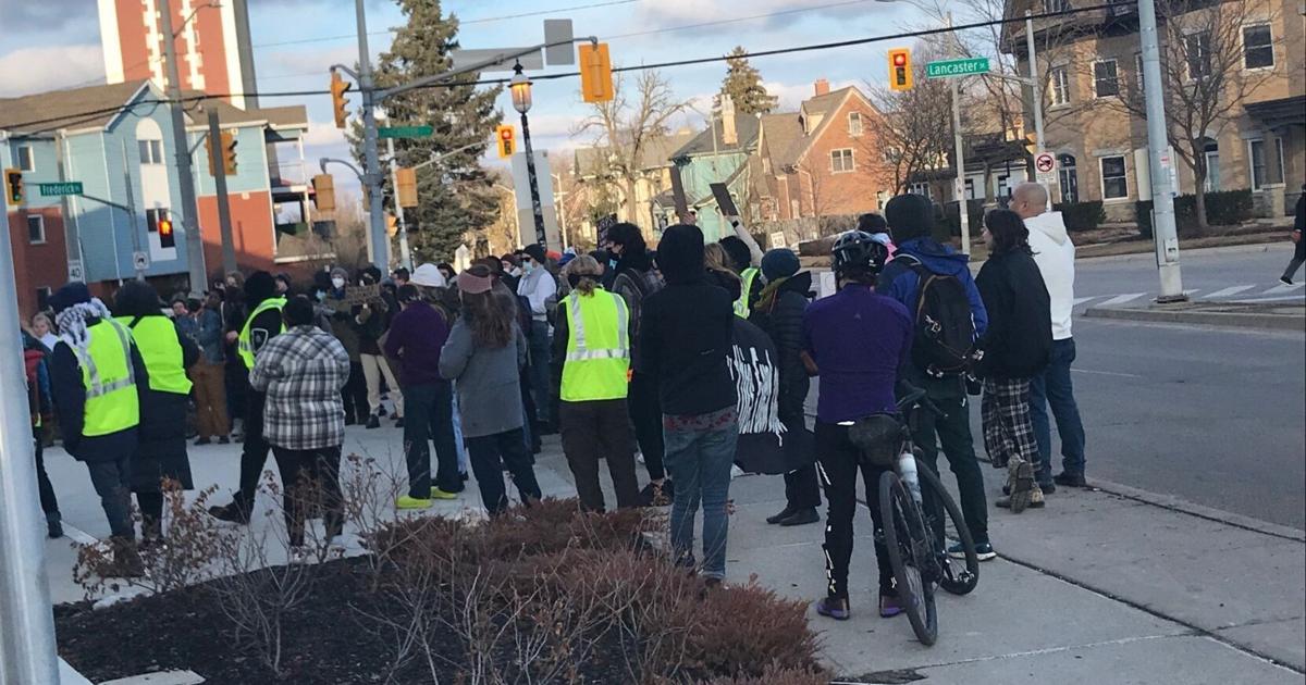 Protesters gather outside Kitchener police station