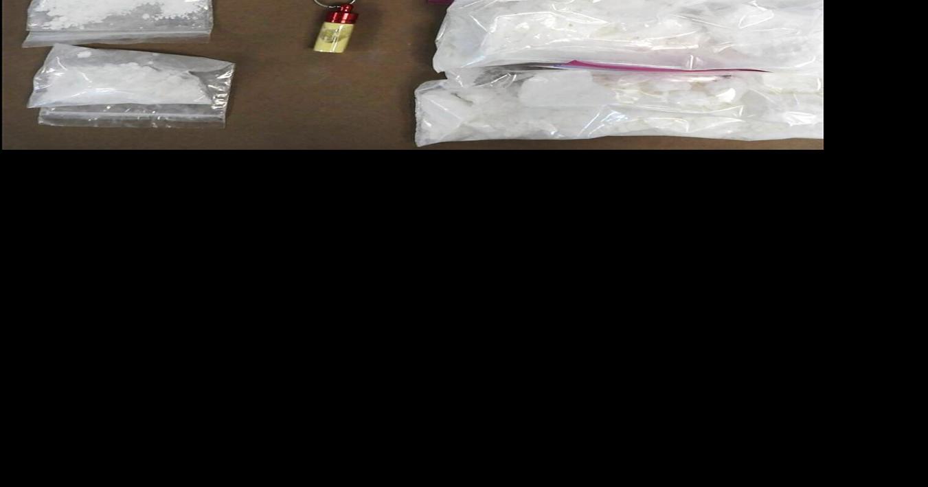 Two men were arrested in a Cambridge drug bust with cocaine, meth and fentanyl; an officer was injured during the arrest after being hit with a Cadillac.