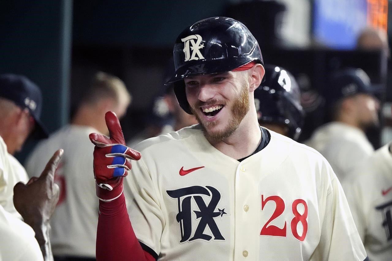 Garcia goes deep again as Rangers roll past Rockies 7-2