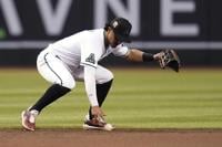 Milwaukee Brewers first baseman Rowdy Tellez, right, reaches out to catch a  throw to first base to get Arizona Diamondbacks' Alek Thomas (5) out during  the sixth inning of a baseball game