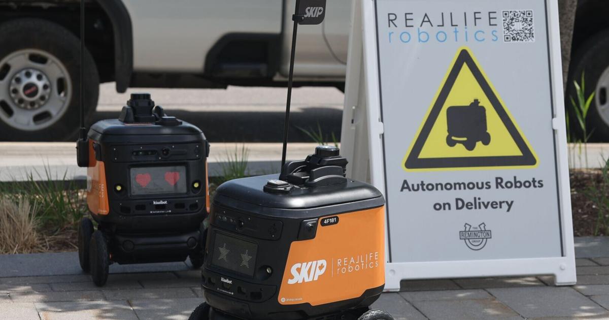 UW robot delivery system on the road, delivering food