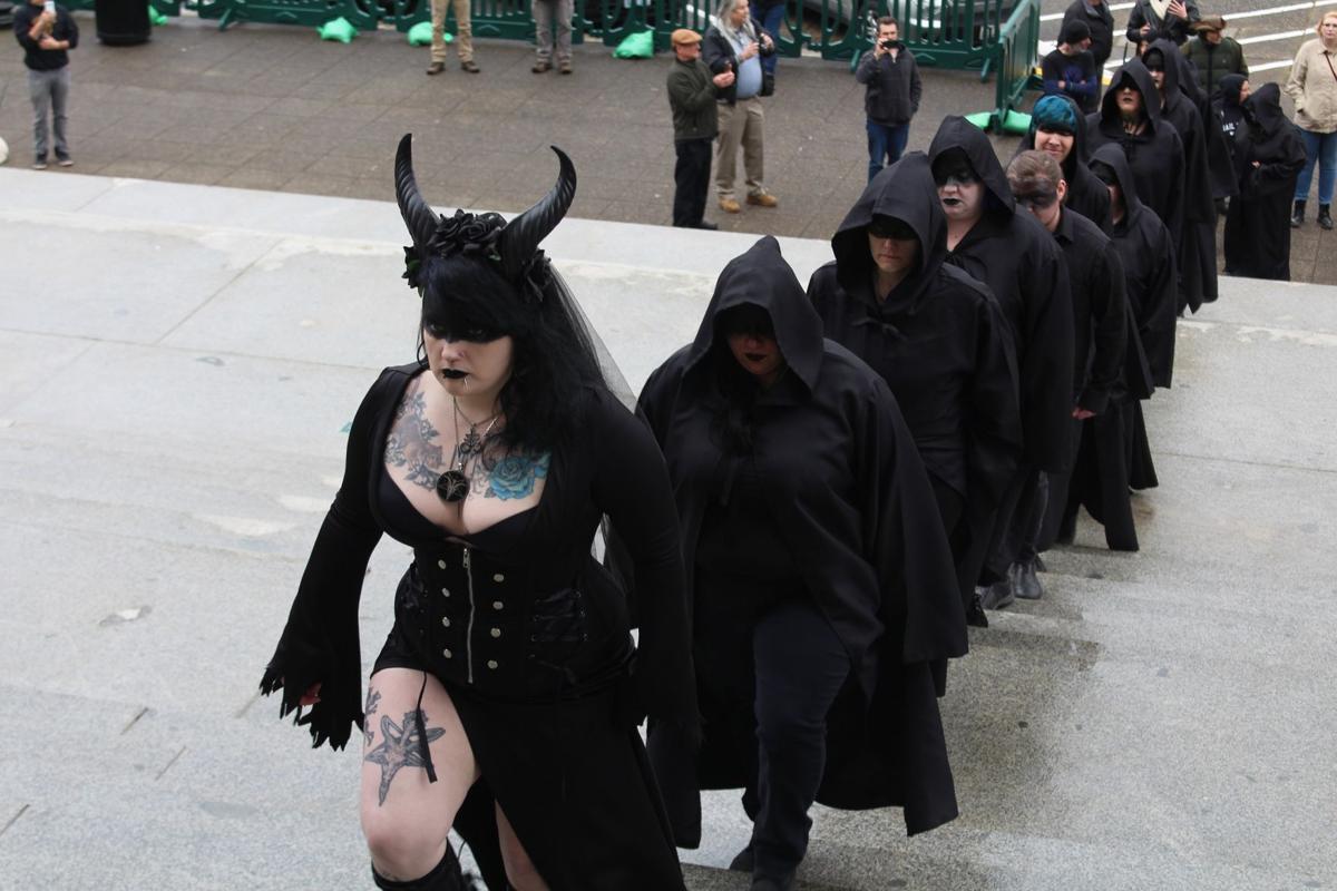 Amid pious protesters, Satanists conduct a ritual on the Capitol steps