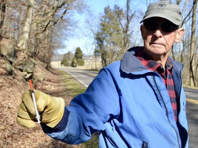 Picking up roadside litter at his Surgoinsville farm a 'full time job