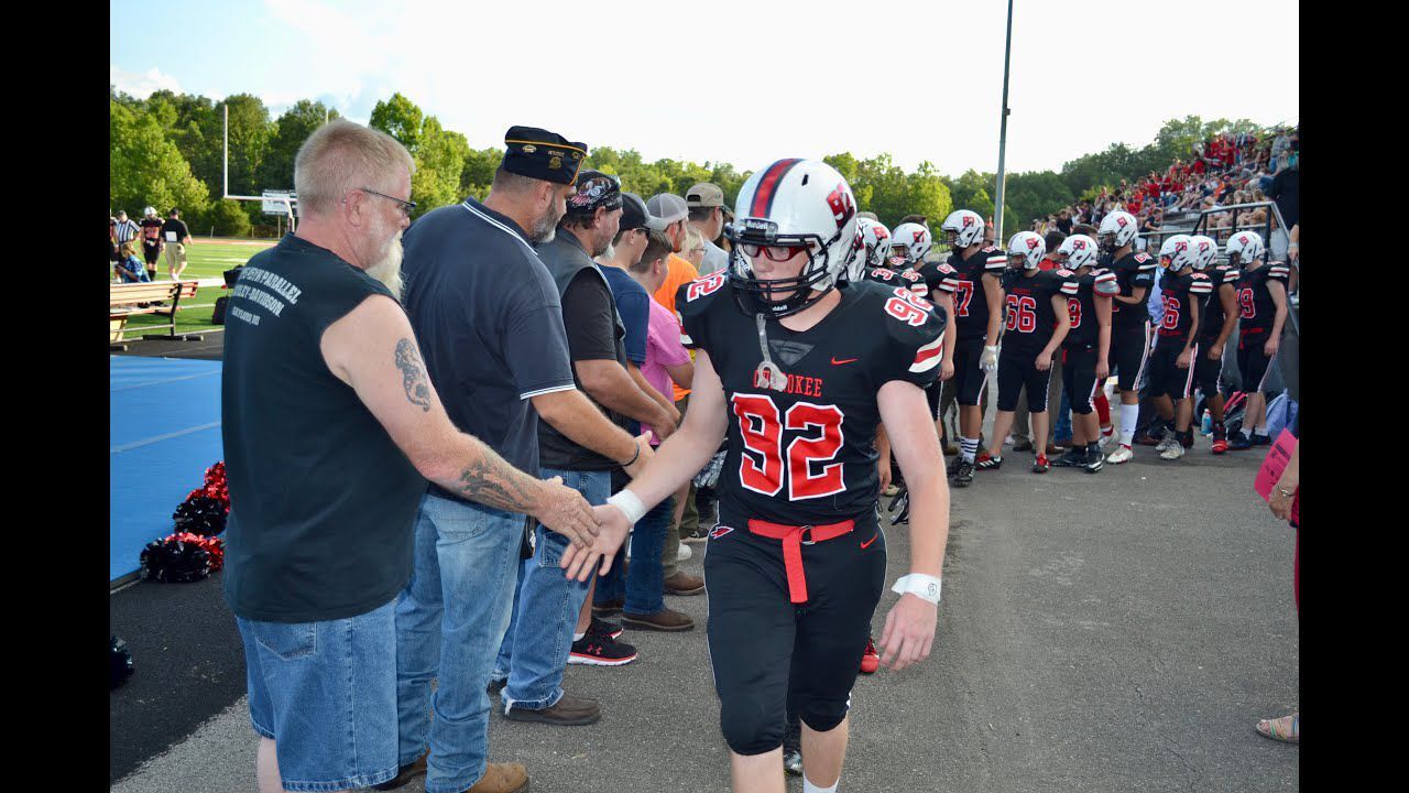 Friends and family of injured Cherokee High football player hold