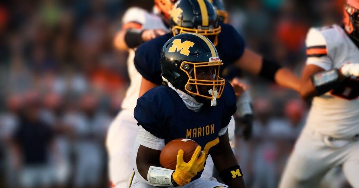 Carterville survives late push by Marion, 28-24