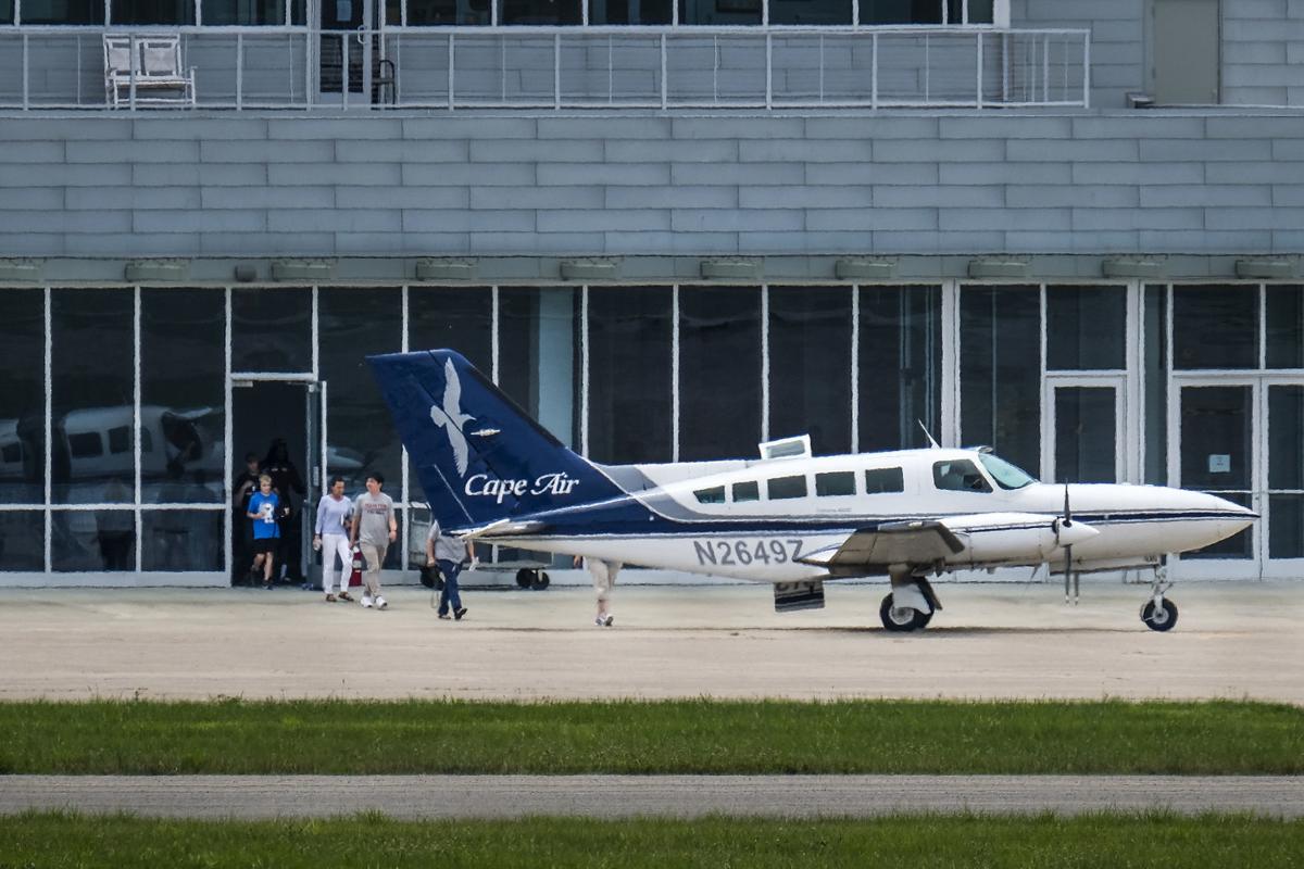 Passengers prepare to board a Cape Air flight