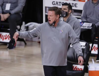 Head coach Bill Self of the Kansas Jayhawks coaches from the bench in the first half on February 13, 2021 at Hilton Coliseum in Ames, Iowa.