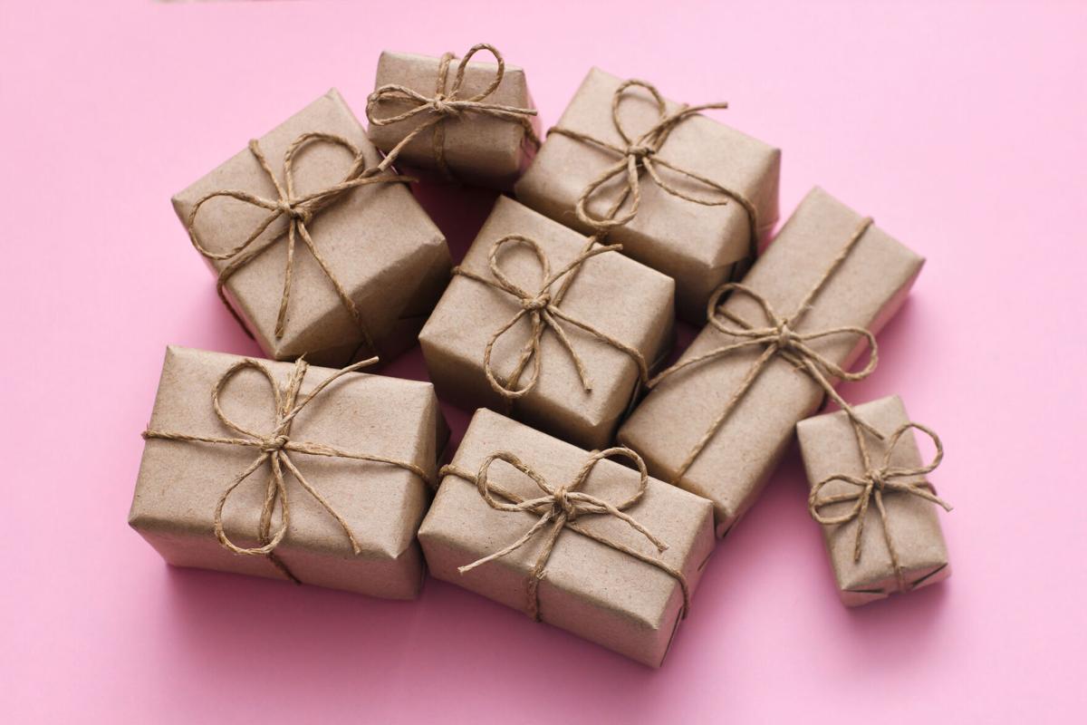 Wrapping gifts in brown grocery bags or parcel paper makes use of an everyday item that you may already have in your home while keeping your wrapping recyclable.