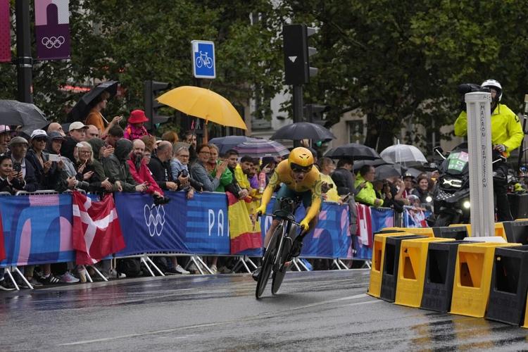 Grace Brown of Australia wins the Olympic time trial over the rainy