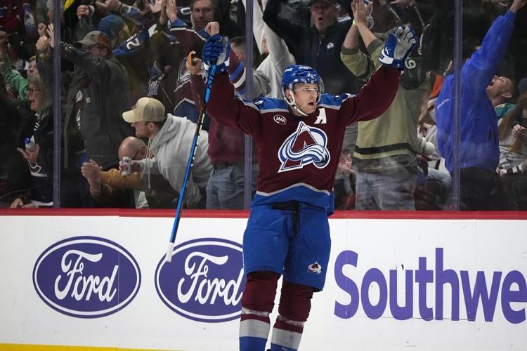 MacKinnon scores in OT to lift Avalanche past Ducks 43 for 1st win