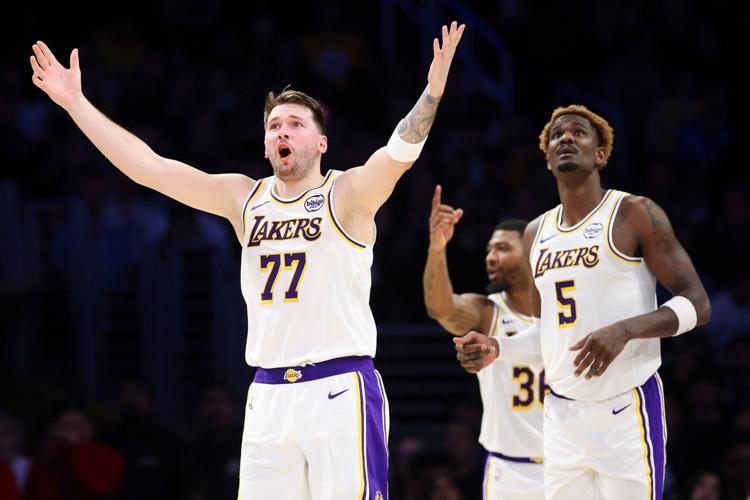 Luka Doncic and LeBron James combine for 68 points, Lakers end skid ...