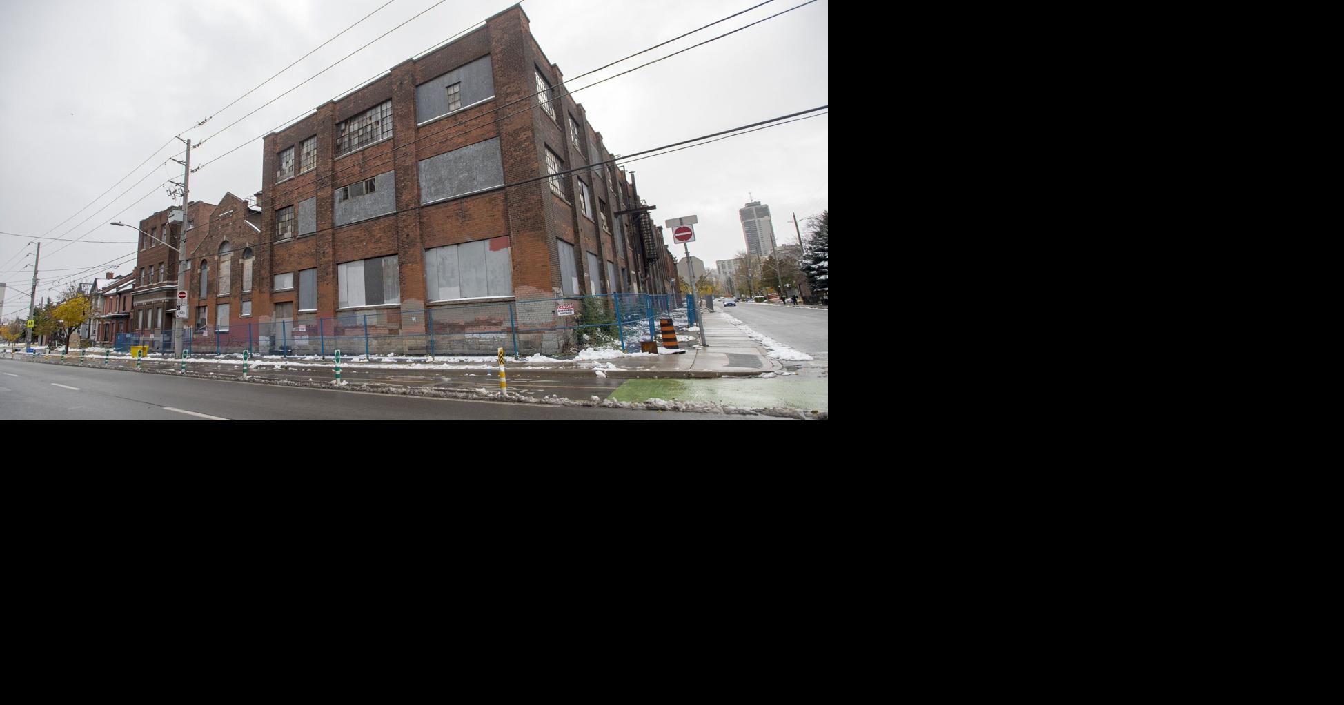 Owner vows condos at derelict factory forthcoming as regulator pursues millions owed on Buffalo project.