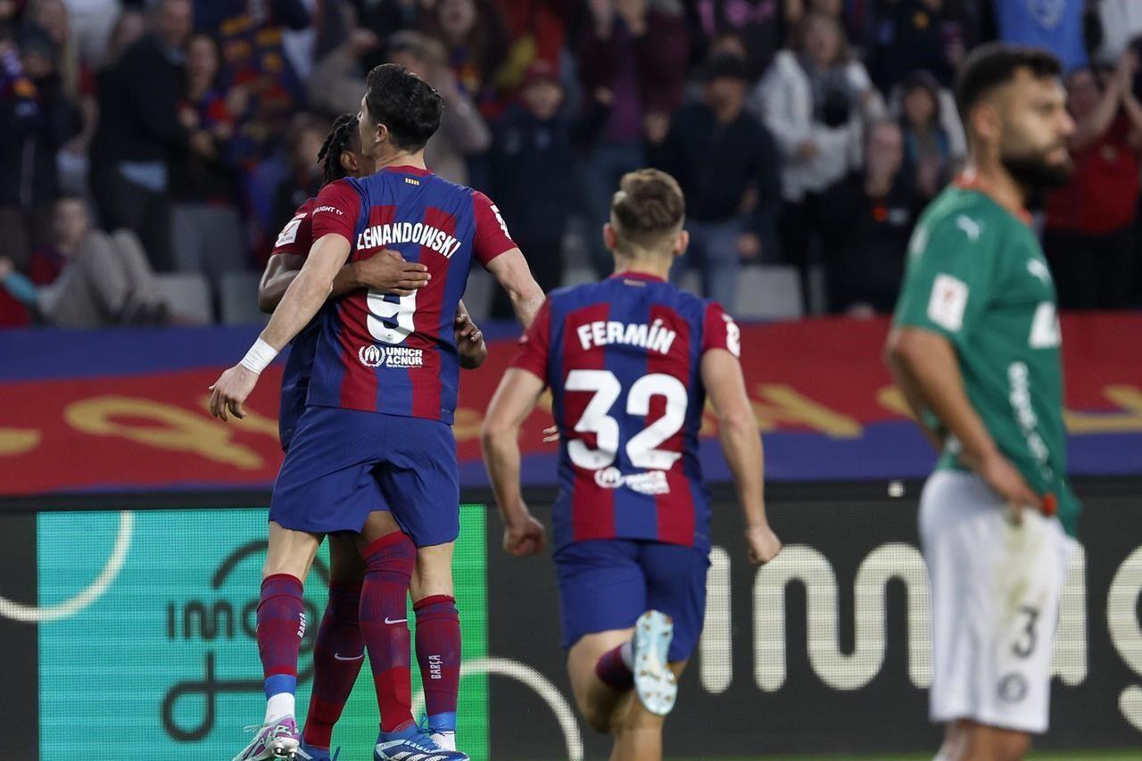 Lewandowski, Cancelo lead Barcelona to 3-2 comeback win over Celta with 3  goals in final 10 minutes