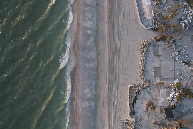 Florida digs out of mountains of sand swept in by backtoback hurricanes