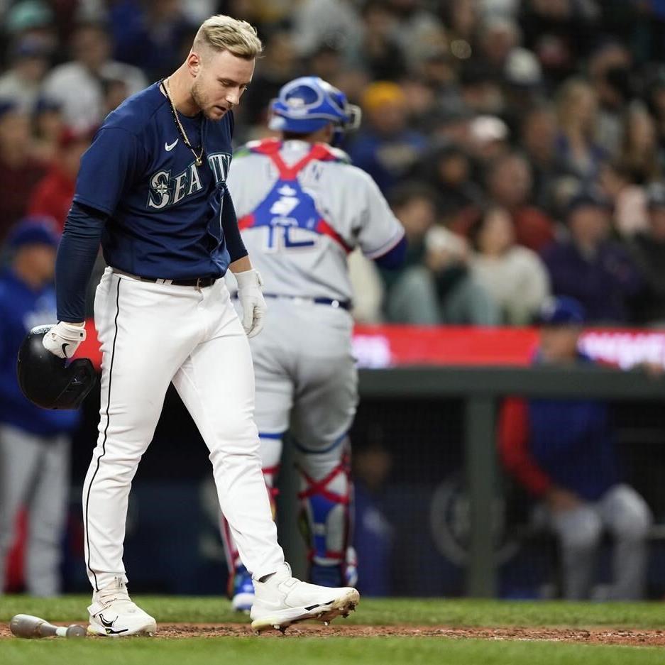 Rangers finally get to Gilbert, top Mariners 2-1 behind Gray