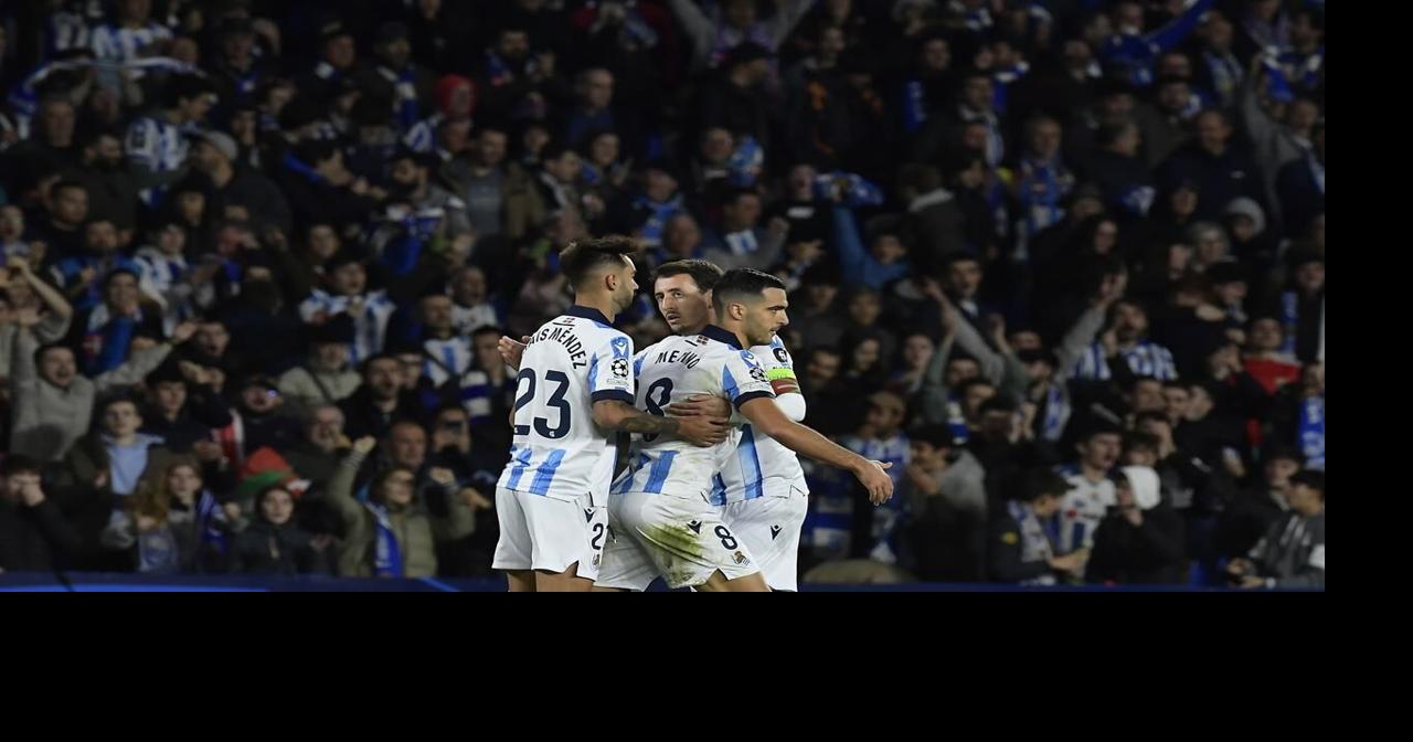 Benfica fans throw flares toward Sociedad supporters at Champions League match