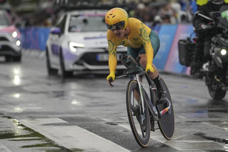 Grace Brown of Australia wins the Olympic time trial over the rainy