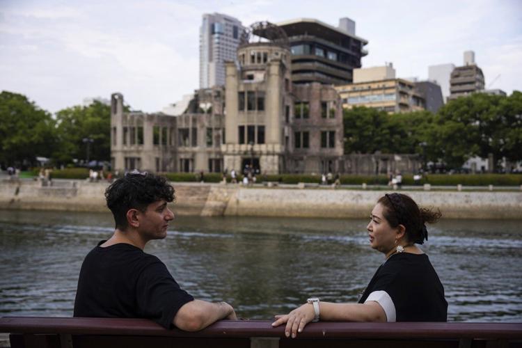 Grandchildren of 2 men who experienced both A bomb attacks in Japan