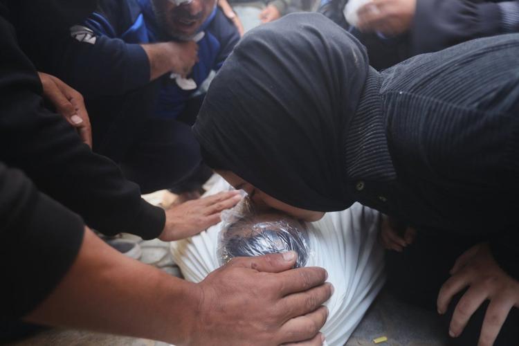 Palestinians hold funerals for pregnant woman and her children killed ...