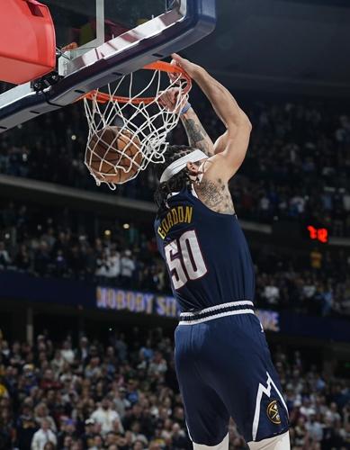 Jokic's 35 points pace Nuggets in 115-112 win over short-handed