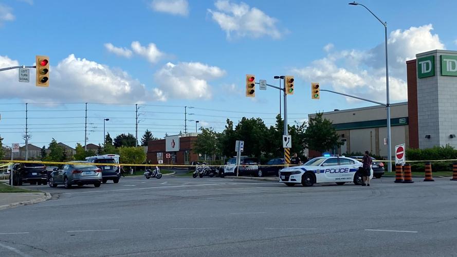 Police confirm suspect taken into custody after two people shot in ...